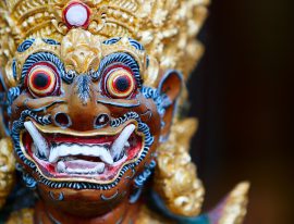 Closeup of Balinese God statue in temple complex